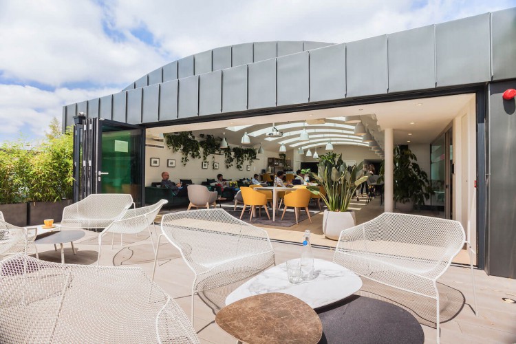 The office space in Dallington Street, Clerkenwell boasts a stylish top floor lounge with wall-to-wall skylights, full-height glazing and a private outdoor roof terrace.