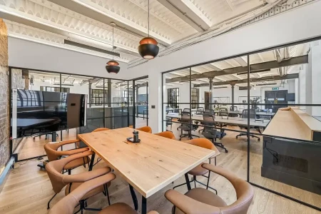 Industrial warehouse property offering managed office space in Albion Mills with rooftop beams and wooden flooring.